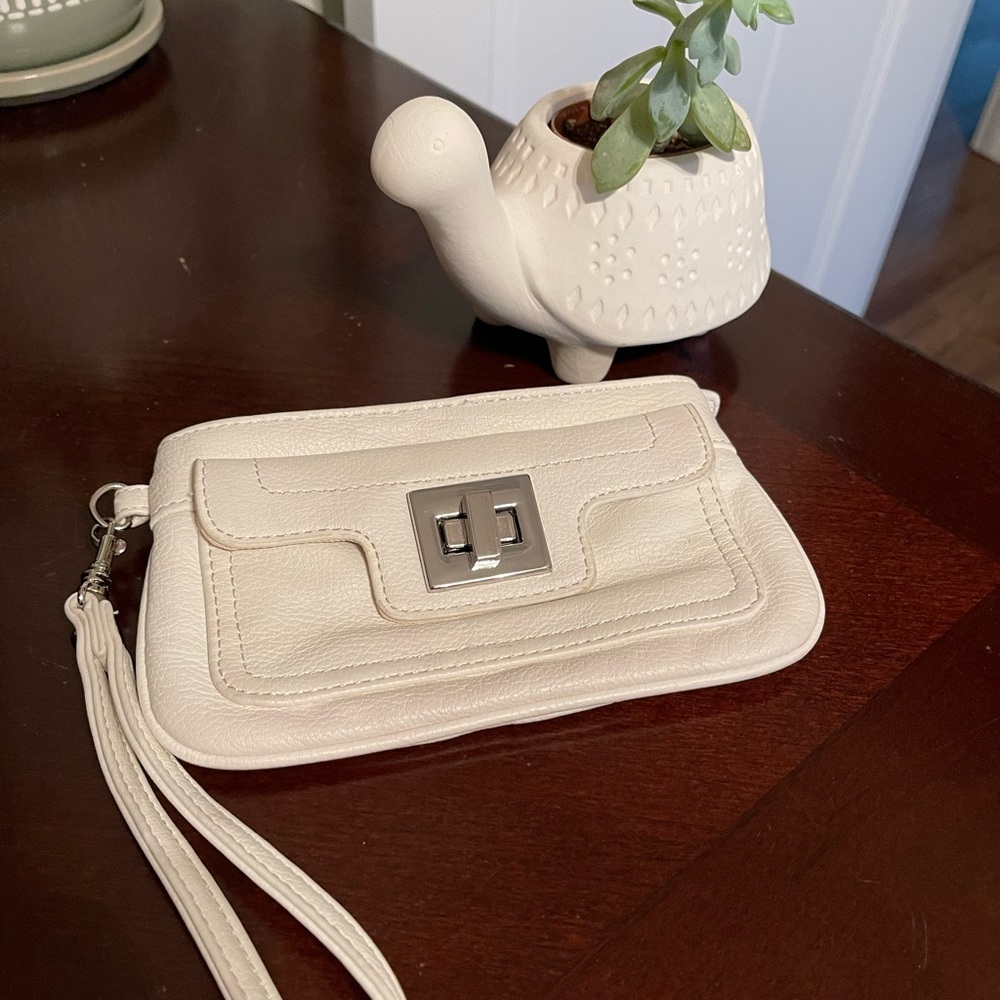 The many moods of Poppie Jones white leather wristlet